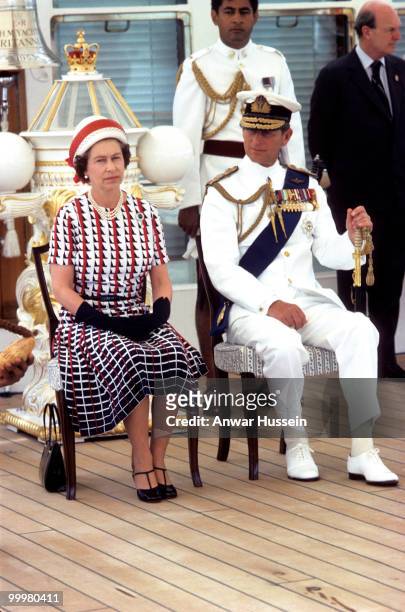 Queen Elizabeth ll and Prince Philip, Duke of Edinburgh receive and are entertained by Fijian folk and traditional dancers on board the Royal Yacht...