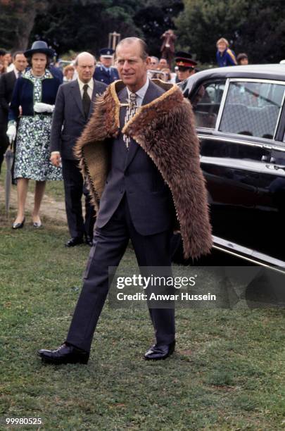 Prince Philip, Duke of Edinburgh wears a kiwi feather cloak as part of the Silver Jubilee Commonwealth Tours in February, 1977 in Gisborne, New...