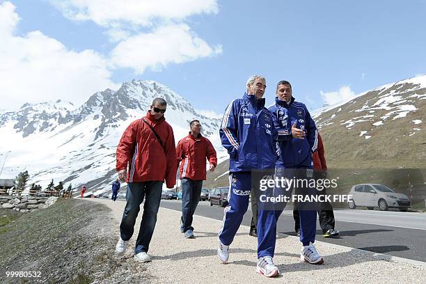 French football coach Raymond Domenech chats with coach assistant Bruno Martini before a training session on May 19, 2010 in Tignes in the French...