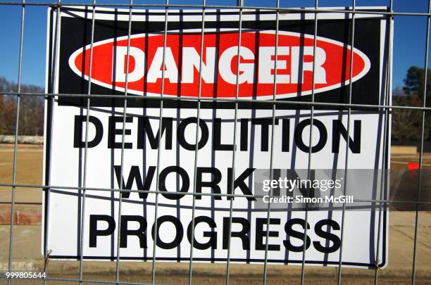 'danger: demolition work in progress' sign on the fence surrounding a construction site - australian capital territory 個照片及圖片檔