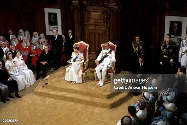 Queen Elizabeth ll and Prince Philip, Duke of Edinburgh attend the State Opening of Parliament during the Queen's Silver Jubilee Tour in February,...