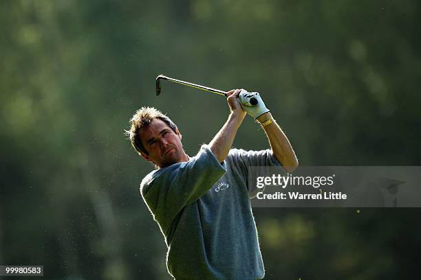 Former Liverpool and Scotland footballer Alan Hansen plays an iron shot during the Pro-Am round prior to the BMW PGA Championship on the West Course...