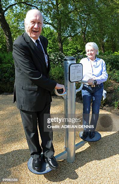 Horton Kennedy and Eve Margolis use an exercise machine during the official opening of the first pensioners' playground in Hyde Park in London on May...