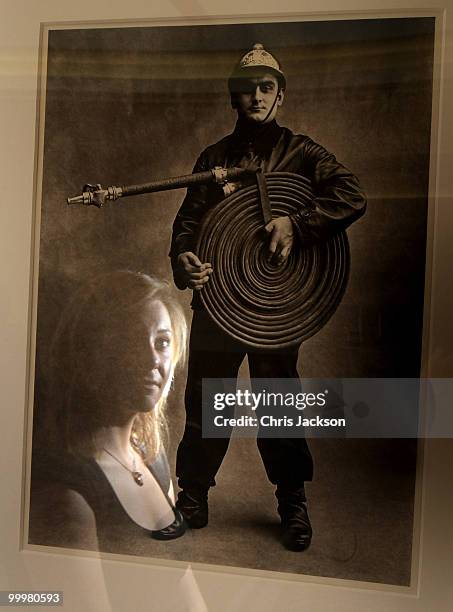 Christies employee looks at a photograph by Irving Pen at Christie's South Kensington on May 19, 2010 in London, England. The photograph will be...