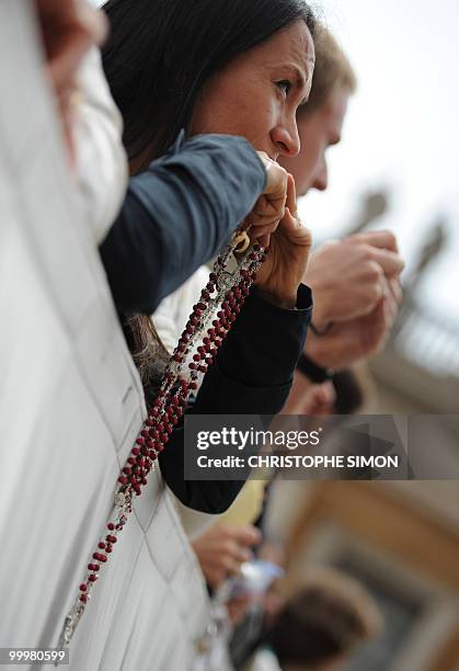 Faithful wait for the arrival of Pope Benedict XVI during his weekly general audience at St Peter's square on May 19, 2010 at The Vatican. AFP PHOTO...