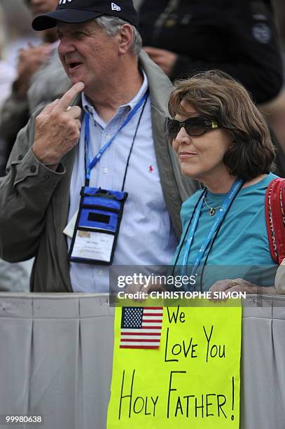 Faithful wait for the arrival of Pope Benedict XVI during his weekly general audience at St Peter's square on May 19, 2010 at The Vatican. AFP PHOTO...