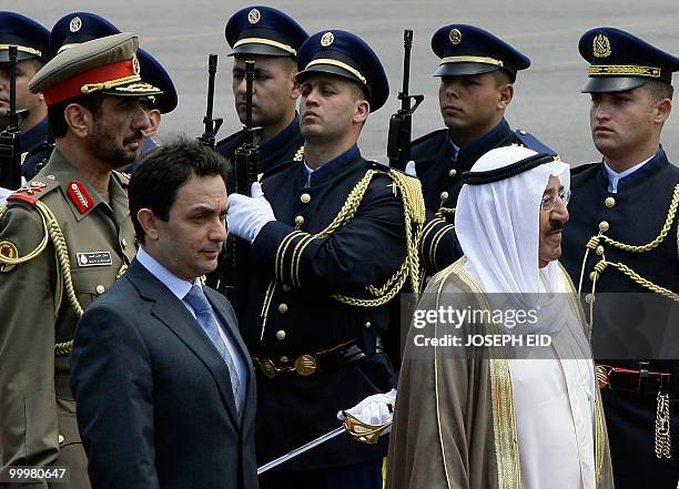 Kuwaiti Emir Sheikh Sabah Ahmed al-Sabah reviews an honour guard with Lebanese Minister of Interior Ziad Baroud during an arrival ceremony in...