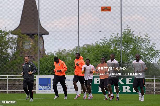Ivory Coast football players warm-up during a practice session on May 19, 2010 in Montreux ahead of the FIFA World Cup 2010 finals in South Africa. A...