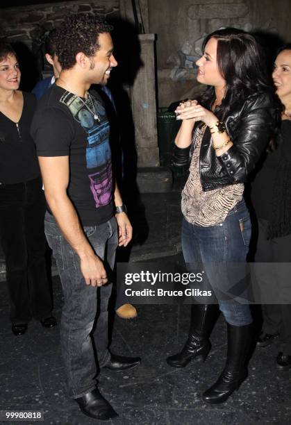 Corbin Bleu and Demi Lovato chat backstage after a performance of "In The Heights" on Broadway at Richard Rodgers Theatre on May 18, 2010 in New York...