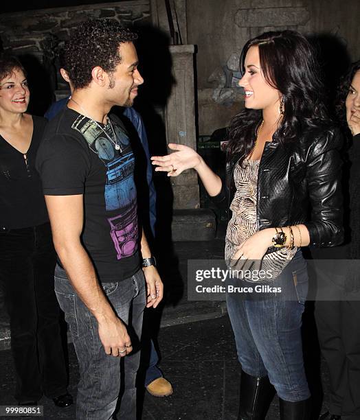 Corbin Bleu and Demi Lovato chat backstage after a performance of "In The Heights" on Broadway at Richard Rodgers Theatre on May 18, 2010 in New York...