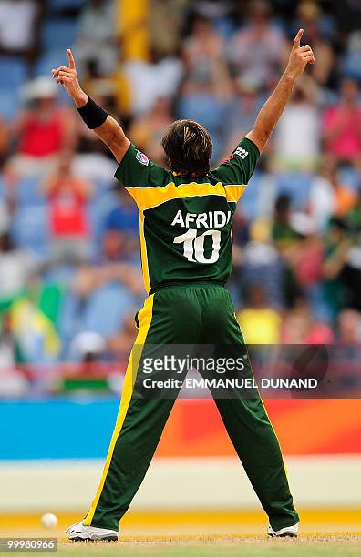 Pakistani captain Shahid Afridi celebrates the wicket of Australian captain Michael Clarke during the ICC World Twenty20 second semifinal match...