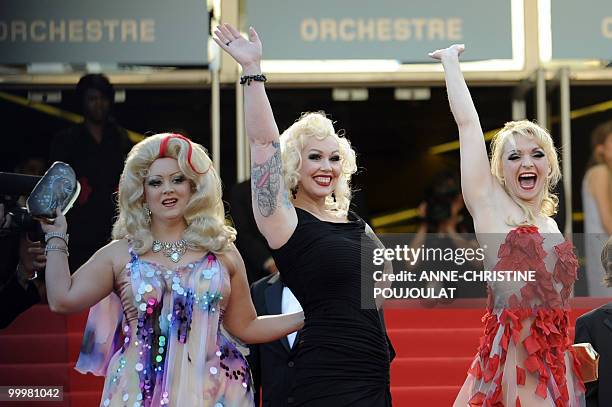 Actress Dirty Martini, actress Mimi Le Meaux and actress Julie Atlas Muz pose before for the screening of the film "Tournee" presented in competiton...