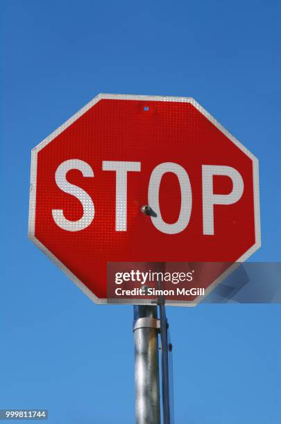 stop sign against a clear blue sky - australian capital territory stock pictures, royalty-free photos & images