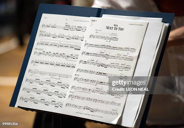 Sheet music is displayed as British recording artist Sting rehearses with the Royal Philharmonic Orchestra at Abbey Road Studios in west London on...