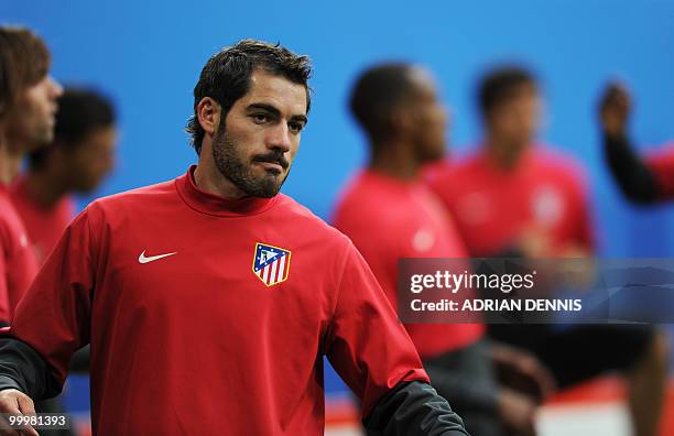 Atletico Madrid's captain Antonio Lopez warms up during a training session at the Nordbank-Arena stadium on May 11, 2010 in Hamburg, northern...