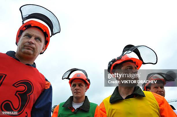 Belarussian lumberjacks wait their turn to participate in the "Forest 2010" lumberjack competition in Minsk on May 19, 2010. A few dozen men proved...