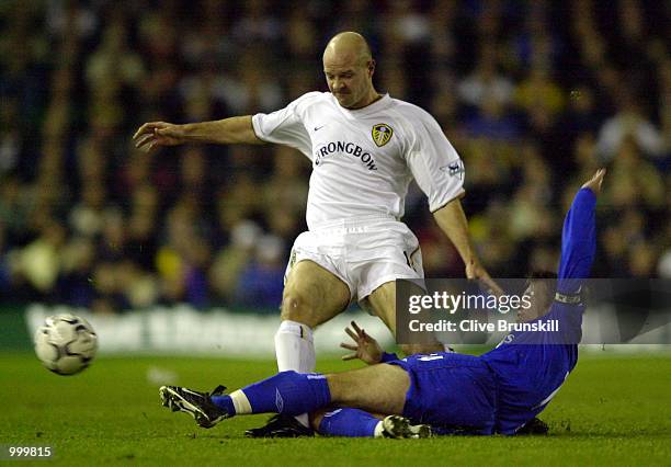 Graeme Le Saux of Chelsea slides in to tackle Danny Mills of Leeds during the match between Leeds United and Chelsea in the Worthington Cup Fourth...