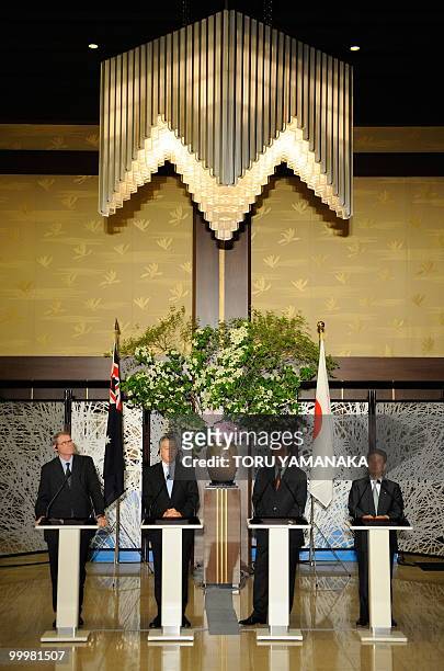 Australian Foreign Minister Stephen Smith answers questions while Australian Defence Minister John Faulkner , Japanese Foreign Minister Katsuya Okada...