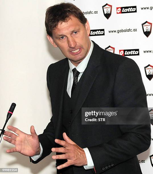 Former Arsenal defender and Portsmouth manager Tony Adams gestures during a news conference in Baku on May 12, 2010. Adams signed a three-year deal...