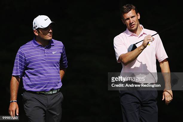 Andriy Shevchenko of the Ukraine talks with Francesco Molinari of Italy during the Pro-Am round prior to the BMW PGA Championship on the West Course...