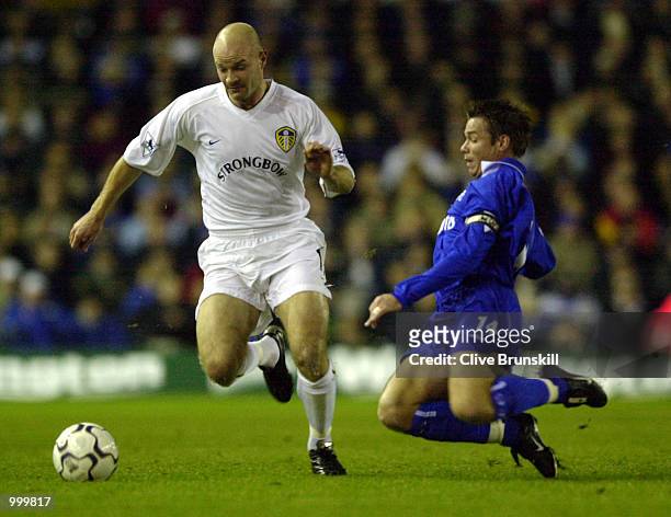 Graeme Le Saux of Chelsea slides in to tackle Danny Mills of Leeds during the match between Leeds United and Chelsea in the Worthington Cup Fourth...
