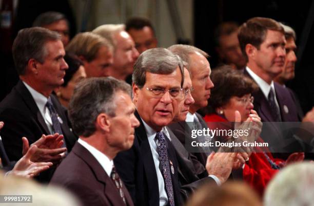 Senate Minority Leader Trent Lott, R-Miss., center, speaks to Senate Majority Leader Tom Daschle, D-S.D., during the Commemorative Joint Meeting of...