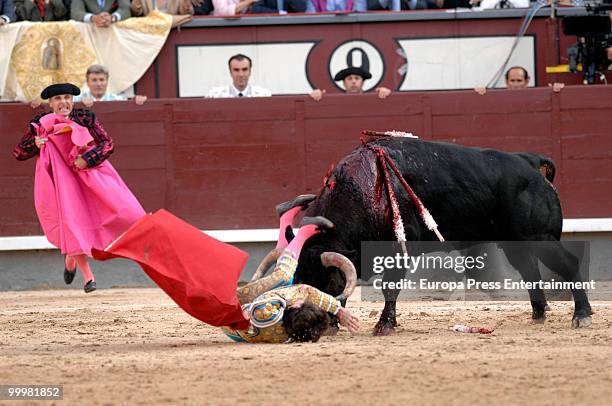 Matador El Cid lands after being tossed in the air by the bull during the San Isidro Fair Bullfight on May 18, 2010 in Madrid, Spain.