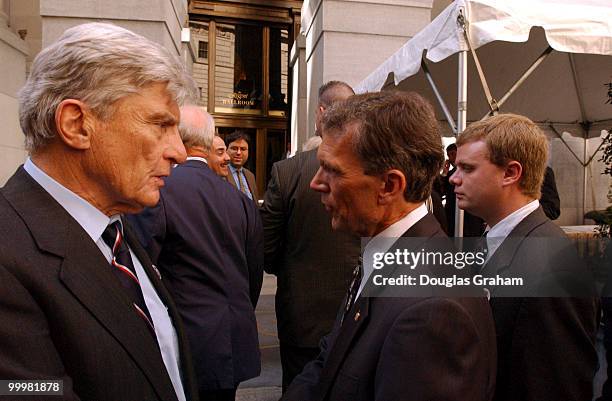 John Warner, R-VA., and Tom Daschle, D-SD., speak on the way to a luncheon after the Commemorative Joint Meeting of Congress held at Federal Hall in...