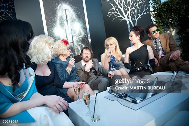 French actor and director Mathieu Amalric wait before Canal Plus TV program "Le Grand Journal" on May 14, 2010 in Cannes, flanked by cast of his...