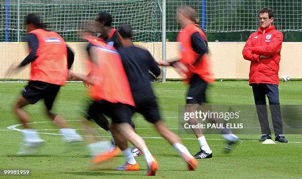 England football coach Fabio Capello watches his players during a team training session in Irdning, Austria on May 19, 2010 ahead of the World Cup...