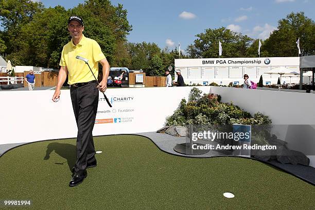 Ross Fisher of England participates in the Putts 4 Charity during the Pro-Am round prior to the BMW PGA Championship on the West Course at Wentworth...