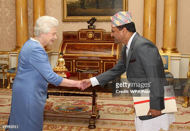 Queen Elizabeth II receives the Ambassador of Nepal Dr Suresh Chandra Chalise as he presents his Credentials at Buckingham Palace on May 19, 2010 in...
