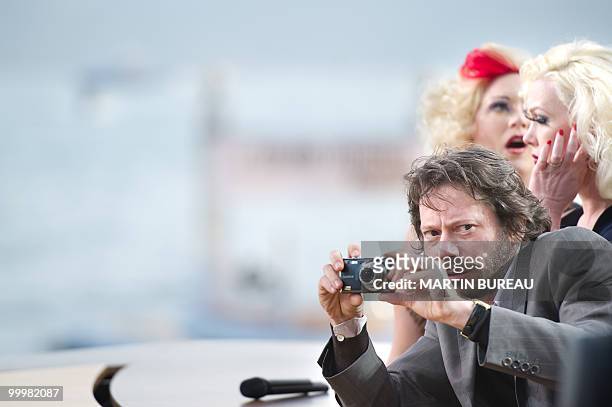 French actor and director Mathieu Amalric attends Canal Plus TV program "Le Grand Journal" on May 14, 2010 in Cannes, flanked by cast of his movie...