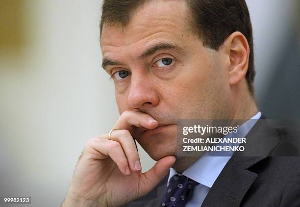 Russian President Dmitry Medvedev listens during a conference about assistance for developing of the civil society of Russia at the Kremlin in Moscow...