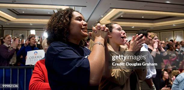 Tonja Alhedaithy reacts to results as they come in at Mark Warner victory party at the Hilton McLean Tysons Corner in McLean, Virginia. November 4,...