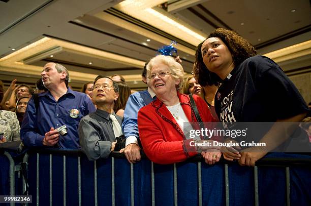 Lloyd Franklin, George Chang, Donna Dick and Tonja Alhedaithy crane to see results as they come in at Mark Warner victory party at the Hilton McLean...