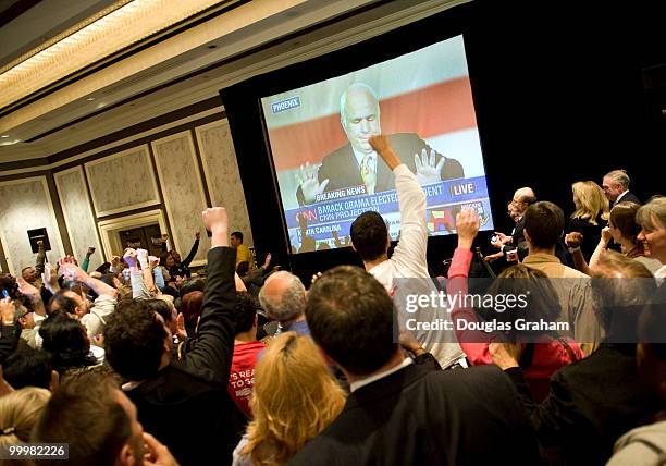 The crowd reacts to John McCain, R-AZ., concession speech to Barack Obama at the Mark Warner victory party at the Hilton McLean Tysons Corner in...