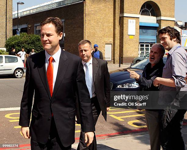 Nick Clegg , the Deputy Prime Minister, is heckled as he arrives to deliver a speech setting out the Government's plans for political reform at the...