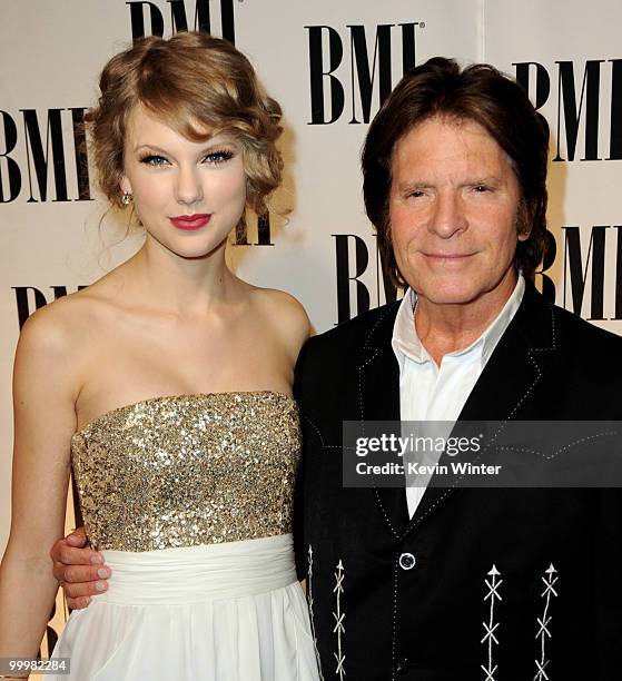 Singer/songwriters Taylor Swift and John Fogerty arrive at the 58th Annual BMI Pop Awards at the Beverly Wilshire Hotel on May 18, 2010 in Beverly...