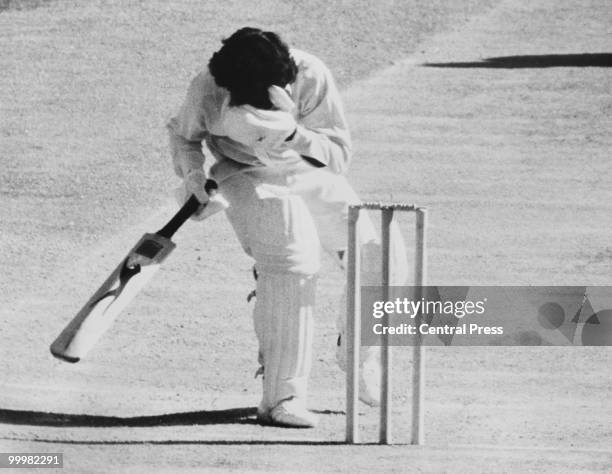 West-Indian batsman Alvin Kallicharran goes down after being hit on the nose by a rising ball from Australian bowler Dennis Lillee, during the Second...