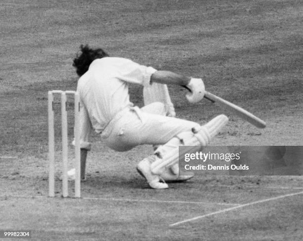 England cricketer Mike Brearley ducks from a bumper from West Indies fast-bowler Vanburn Holder during the first day of the Second Test at Lord's,...