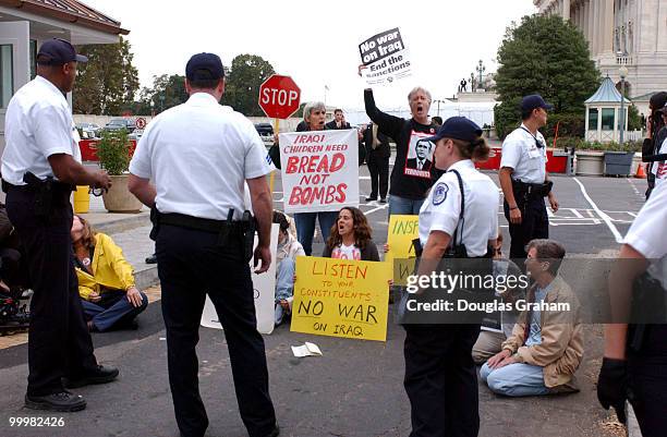 Anti-war protesters stage a sit-in, at the U.S. Capitol. They were later arrested by U.S. Capitol Police for civil disobedience