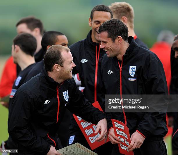 Wayne Rooney shares a joke with Jamie Carragher during an England training session on May 19, 2010 in Irdning, Austria.