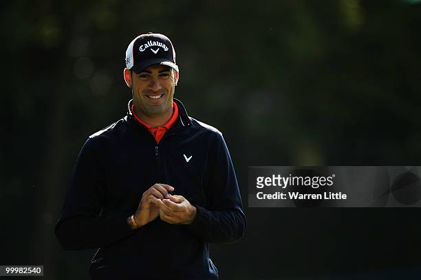 Alvaro Quiros of Spain prepares to play an iron shot during the Pro-Am round prior to the BMW PGA Championship on the West Course at Wentworth on May...