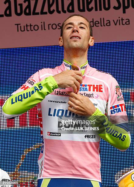 Italia's Vincenzo Nibali of the Liquigas - Doimo team wears-on his pink jersey on the podium after winning the fourth stage of the 93rd Giro...