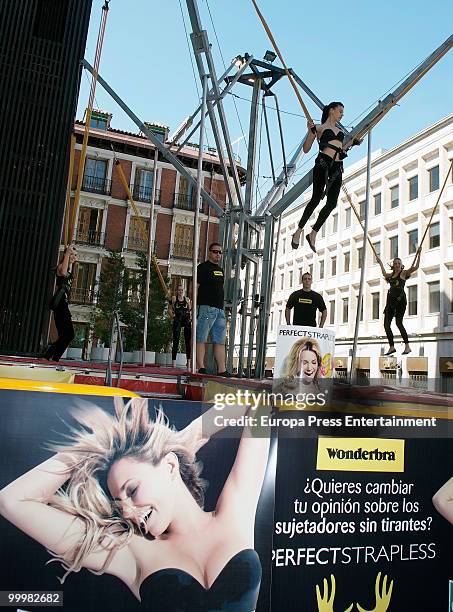 Model wearing the bra 'Perfect Strapless, designed by Wonderbra, jumps on a trampoline to test the effectiveness of the new item of clothing at El...