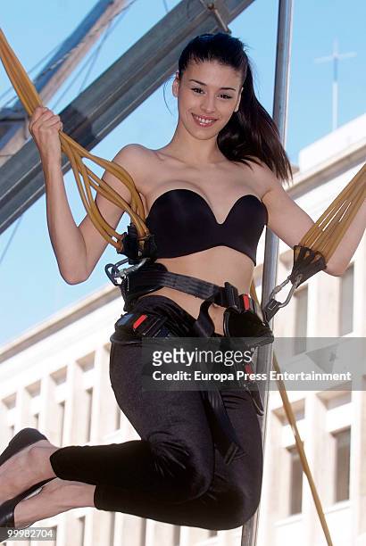 Model wearing the bra 'Perfect Strapless, designed by Wonderbra, jumps on a trampoline to test the effectiveness of the new item of clothing at El...