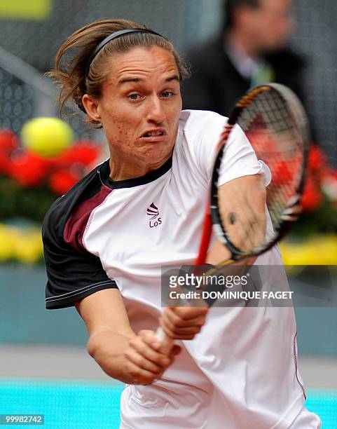 Ukrainian Oleksandr Dolgopolov JR. Returns the ball to Spanish Rafael Nadal during their match of the Madrid Masters on May 12, 2010 at the Caja...