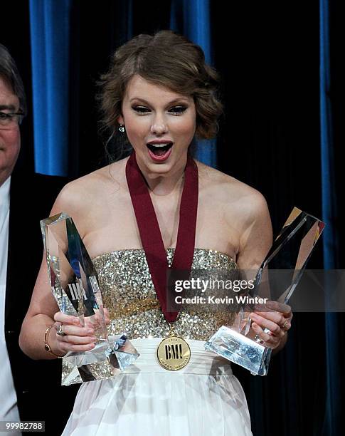 Singer/songwriter Taylor Swift accepts Pop Song of the Year awards at the 58th Annual BMI Pop Awards at the Beverly Wilshire Hotel on May 18, 2010 in...