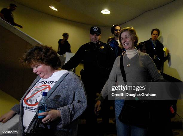 Protesters are removed from the 5th floor of the Hart Senate Office Building by U.S. Capitol Hill Police after they hung anti-war banners from the...